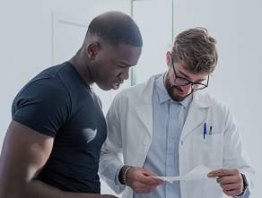 A doctor showing a patient their results