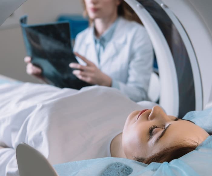 A woman having a full body mri scan